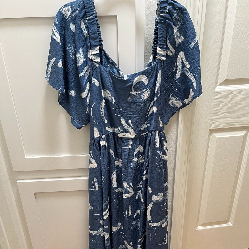 Fun dress with a lot of movement! Worn only once!